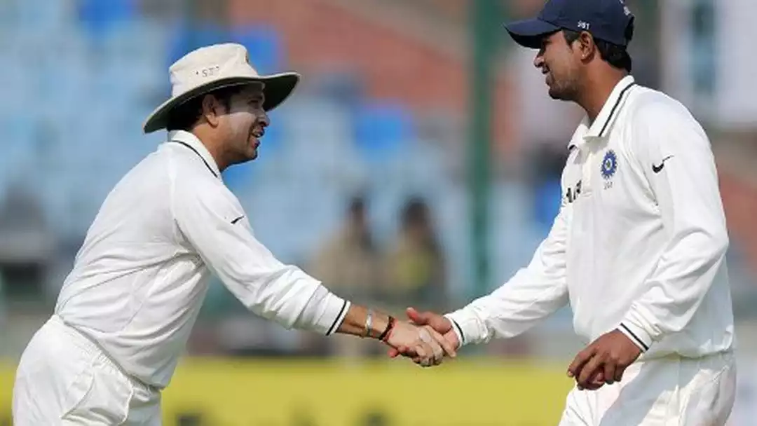Prgyan Ojha with Sachin Tendulkar